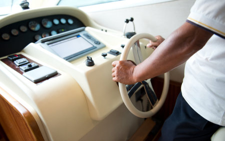 People at the helm of a luxury yacht.の写真素材