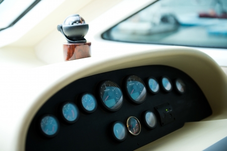 Compass and dashboard instruments of a yacht.の写真素材