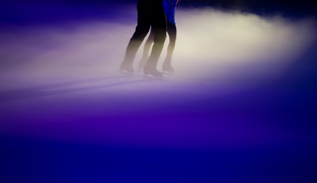 People ice figure skating with beautiful light effect.の写真素材