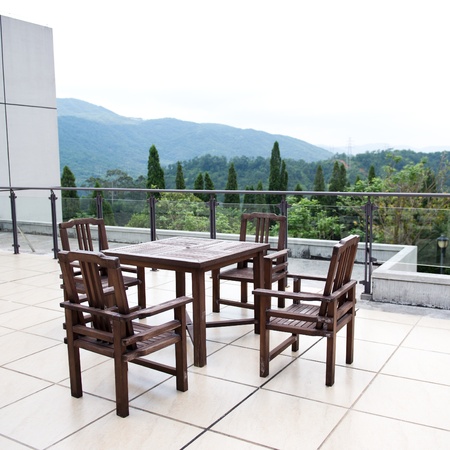 Apartment building roof top terrace exterior with table and chairs.の写真素材