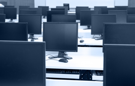 Group of computer neatly placed in a computer lab.の写真素材