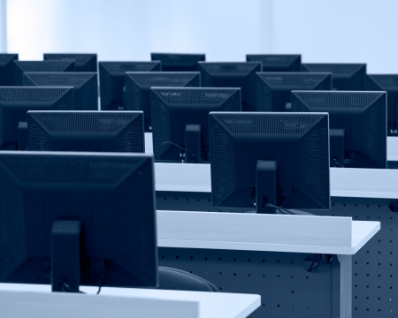 Group of computer neatly placed in a computer lab.の写真素材
