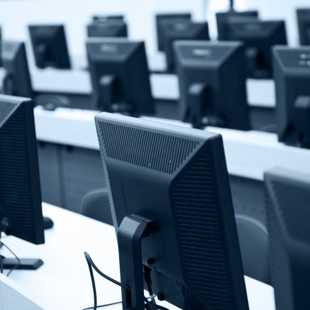 Group of computer neatly placed in a computer lab.の写真素材