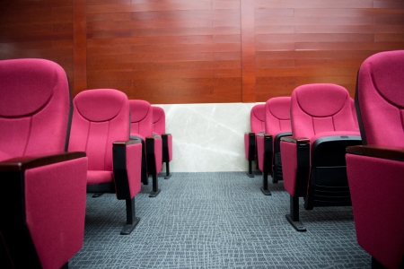 Empty hall for presentation with red armchairs.の写真素材