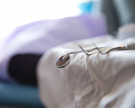 Metallic dentist tools close up in a dentist clinic.の写真素材