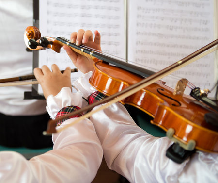 The pupils playing the violin in front of sheet music.の写真素材