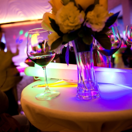 colourful cocktails resting on the bar at a nightclub.の写真素材