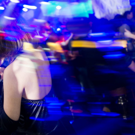Cheerful women dancing at the night club.