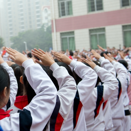 group of children with their hands upの写真素材