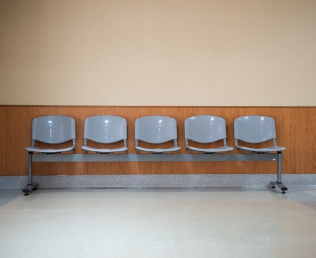 Row of chairs in the hospital hallway.の写真素材