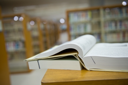 library with stack of books opened.の写真素材