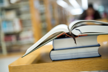 library with stack of books opened.の写真素材