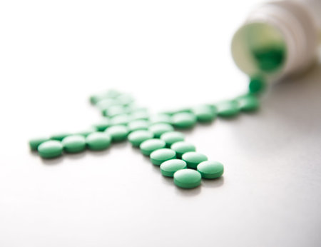 Many pills spilling out of pill bottle.の写真素材