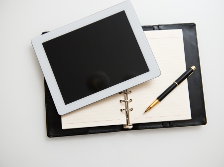 Modern workplace with digital tablet, pen and papers.の写真素材