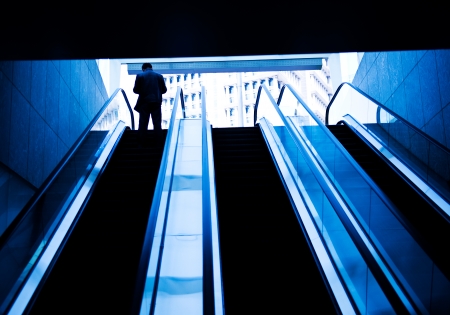 Low angle view looking to top of modern escalator with blue tone.の写真素材