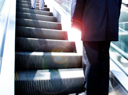 Low angle view looking to top of modern escalator.の写真素材