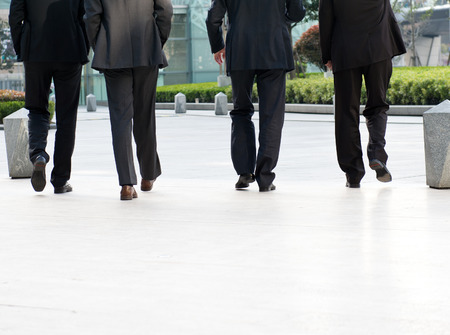 Low section of businesspeople walking together.の写真素材