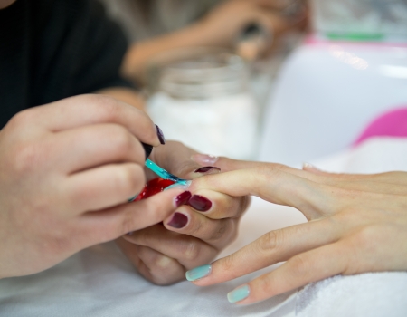 Woman in a beauty salon making nails.の写真素材
