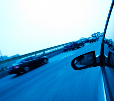 Car driving fast along the motorway.の写真素材