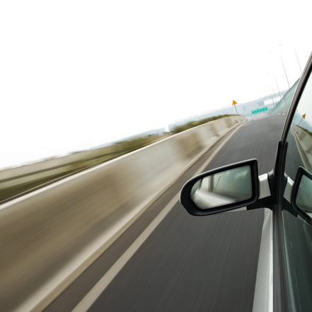 Car driving fast along the motorway.