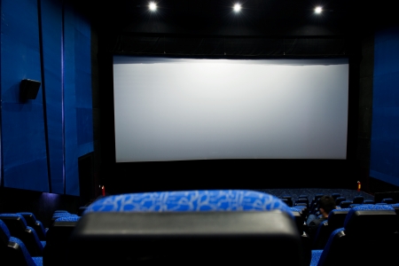 Dark movie theatre interior. screen and chairs.のeditorial素材