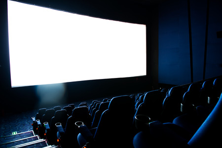 Dark movie theatre interior. screen and chairs.のeditorial素材