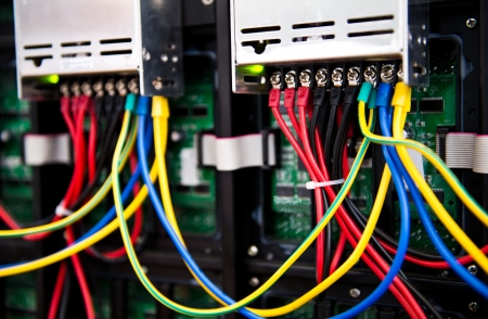 Server front side showing colorful switches and wiring.の写真素材