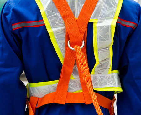 construction site worker with safety rope.