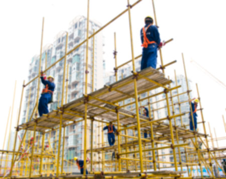 Construction workers working on scaffolding