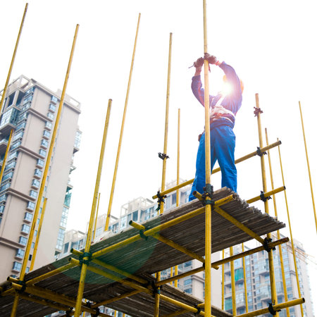 Construction workers working on scaffolding