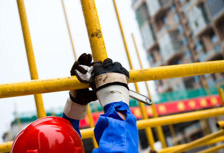 Construction workers working on scaffolding