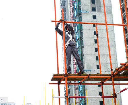 Construction workers working on scaffolding