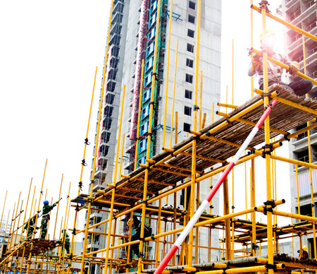 Construction workers working on scaffolding