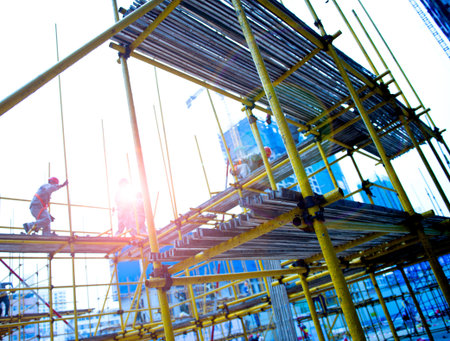 Construction workers working on scaffolding