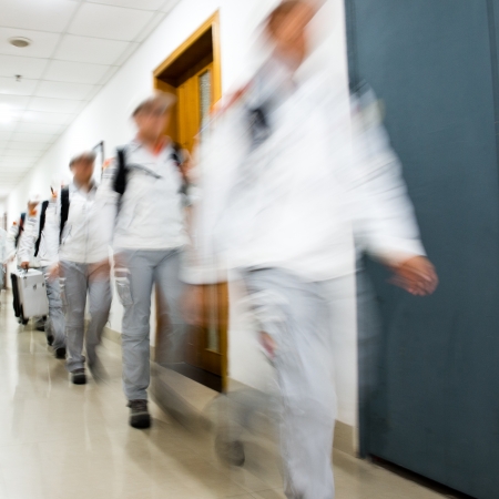 Group of people rushing in the lobby. motion blurの写真素材