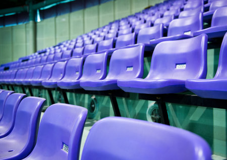 Rows of blue stadium seats with numbers.の写真素材