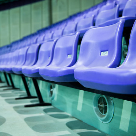 Rows of blue stadium seats with numbers.の写真素材