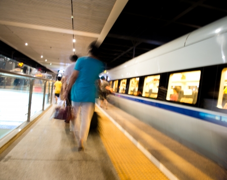 People hurrying to catch a train. blurred motionの写真素材
