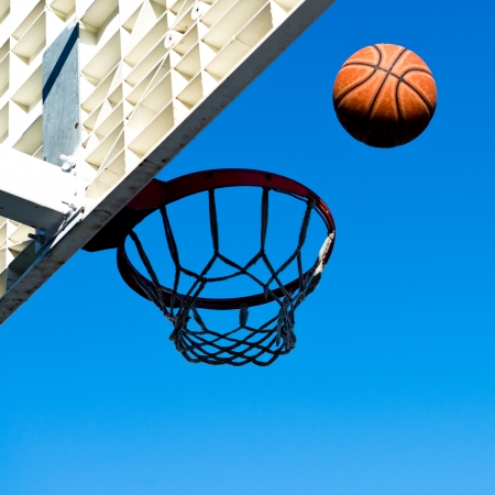 A basketball field goal with the sky in background.の写真素材