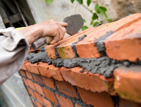 builder laying bricks in site.の写真素材