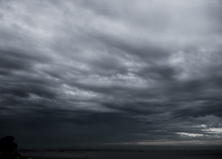 Background of dark clouds before a thunder-stormの写真素材