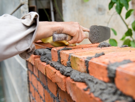 builder laying bricks in site.の写真素材