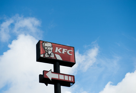 FUJIAN, CHINA - JULY 26: KFC's logo on blue sky  on July. 26, 2013 in Fujian, China. Kentucky Fried Chicken Restaurant is the world's largest chain of hamburger and chicken fast food restaurants.のeditorial素材