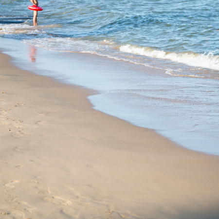 wave of the sea on the sandy beachの写真素材