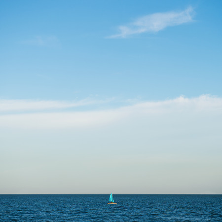 Blue sea with white clouds for background.の写真素材