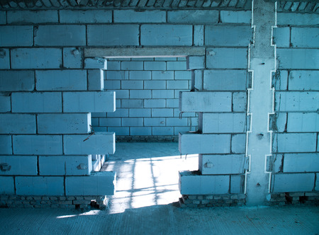 old grunge concrete wall with broken door.の写真素材