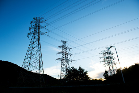Electric power station against bright sky.の写真素材