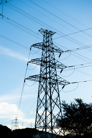 Electric power station against bright sky.の写真素材