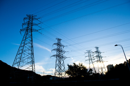 Electric power station against bright sky.の写真素材