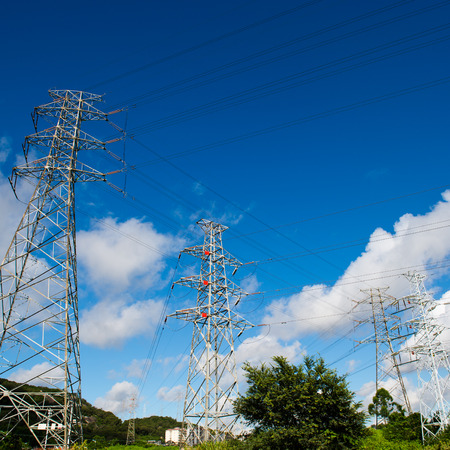 Electric power station against bright sky.の写真素材